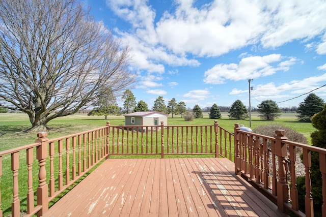 deck featuring an outbuilding and a lawn