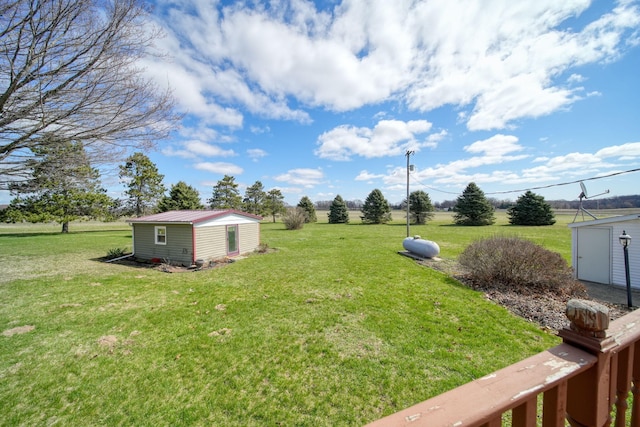 view of yard with an outdoor structure and a shed