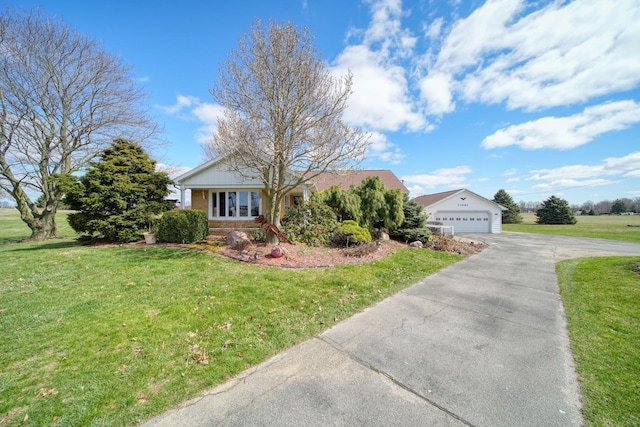 view of front of home with brick siding, a front lawn, and driveway