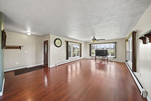 unfurnished living room with a baseboard radiator, wood finished floors, and a textured ceiling
