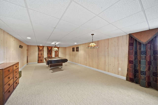 game room with pool table, carpet, a paneled ceiling, and wooden walls