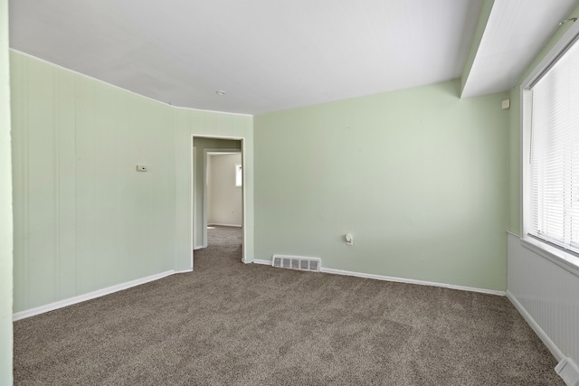 7957 Pine St, Taylor, MI 48180 - empty room with baseboards, visible vents, and carpet flooring