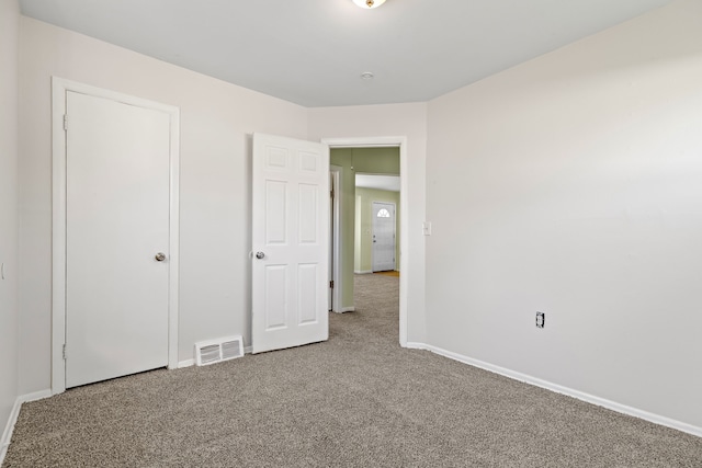 7957 Pine St, Taylor, MI 48180 - unfurnished bedroom with baseboards, visible vents, and carpet