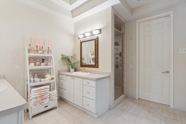 bathroom with tile patterned floors, a shower stall, and vanity