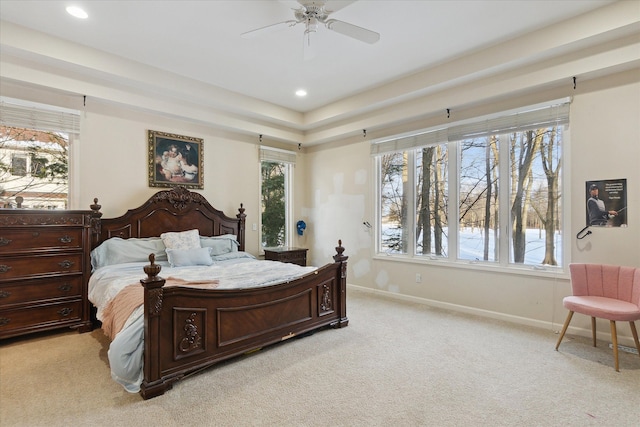 bedroom with recessed lighting, baseboards, multiple windows, and light carpet