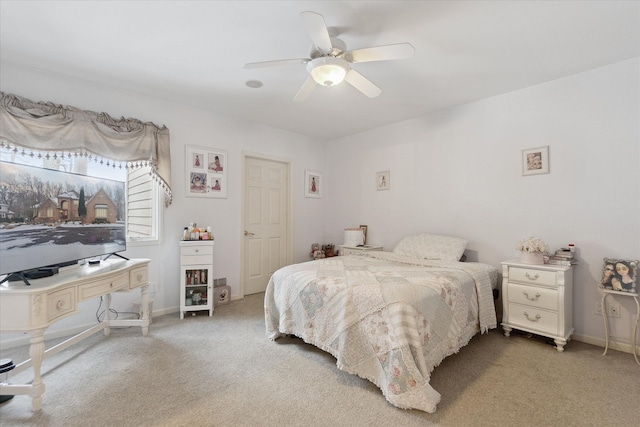 bedroom with carpet flooring, ceiling fan, and baseboards