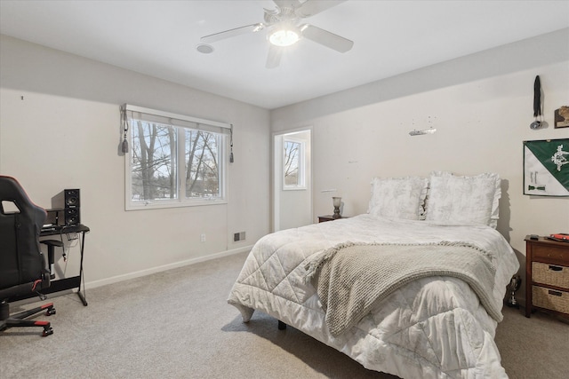 bedroom featuring ceiling fan, baseboards, and carpet floors