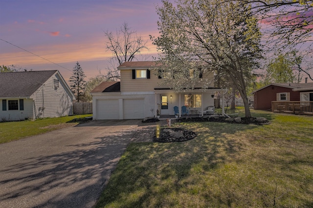 638 Franklin St, Linden, MI 48451 - view of front of property featuring a porch, asphalt driveway, and an attached garage