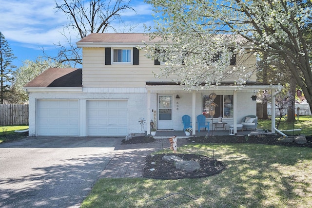 638 Franklin St, Linden, MI 48451 - traditional home with covered porch, brick siding, and driveway