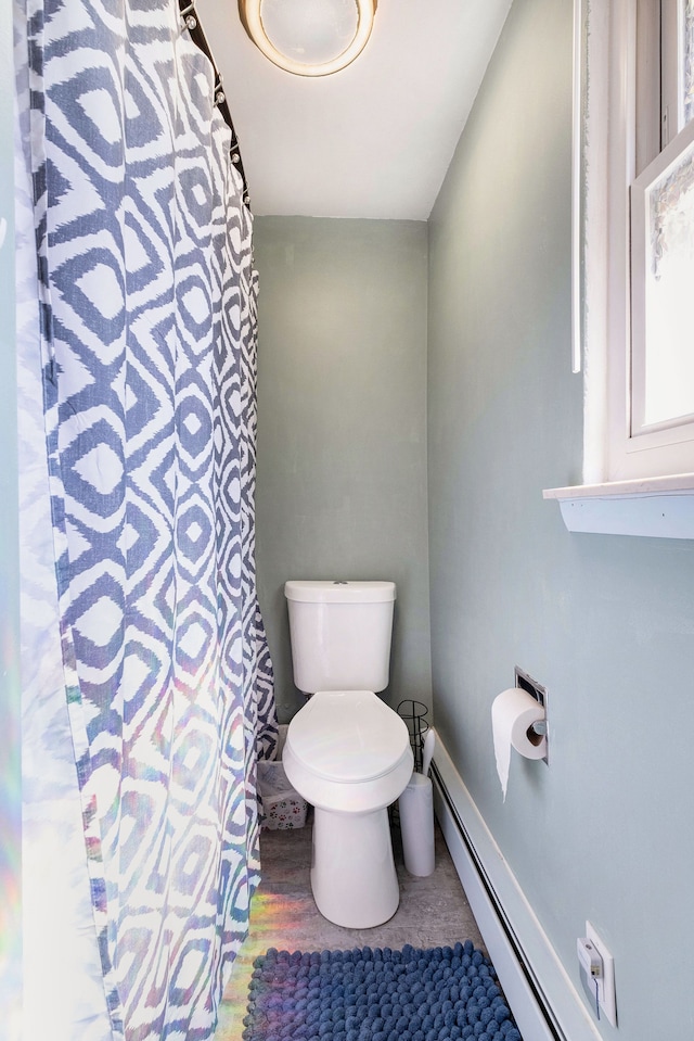 638 Franklin St, Linden, MI 48451 - full bathroom with toilet, a baseboard heating unit, curtained shower, and wood finished floors