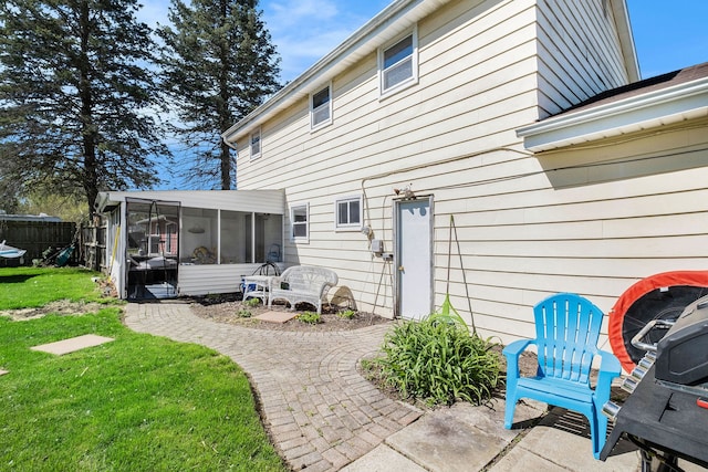638 Franklin St, Linden, MI 48451 - rear view of property featuring a sunroom and a patio