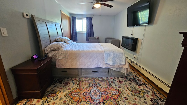 638 Franklin St, Linden, MI 48451 - bedroom featuring baseboard heating and a ceiling fan