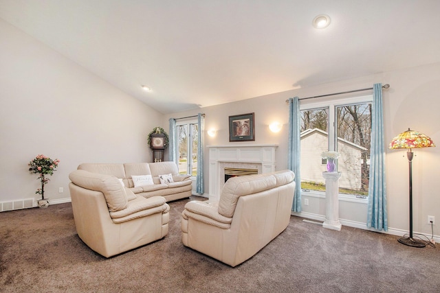 2511 Bowenton Pl SW, Wyoming, MI 49519 - living room featuring lofted ceiling, visible vents, carpet, and baseboards