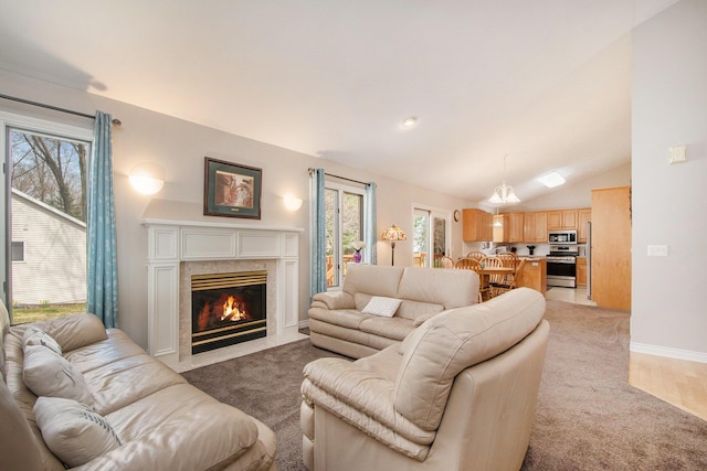 2511 Bowenton Pl SW, Wyoming, MI 49519 - living area with lofted ceiling, baseboards, light carpet, and a fireplace