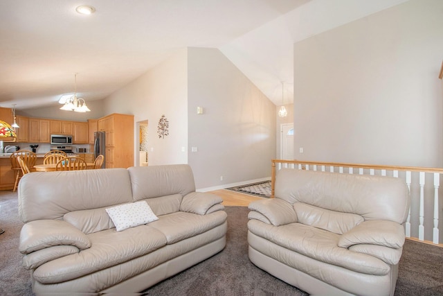 2511 Bowenton Pl SW, Wyoming, MI 49519 - living area with an inviting chandelier, lofted ceiling, and baseboards