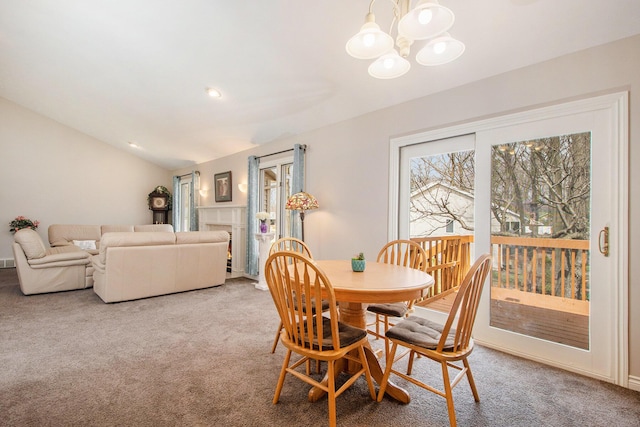 2511 Bowenton Pl SW, Wyoming, MI 49519 - dining area featuring carpet, vaulted ceiling, and a chandelier