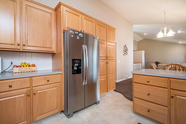 2511 Bowenton Pl SW, Wyoming, MI 49519 - kitchen with a chandelier, tasteful backsplash, light countertops, and stainless steel fridge