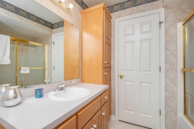 2511 Bowenton Pl SW, Wyoming, MI 49519 - bathroom featuring an enclosed shower, vanity, and wallpapered walls