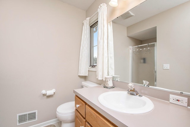 2511 Bowenton Pl SW, Wyoming, MI 49519 - full bath with visible vents, a stall shower, baseboards, toilet, and vanity