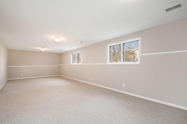 2511 Bowenton Pl SW, Wyoming, MI 49519 - below grade area with baseboards, visible vents, and light colored carpet