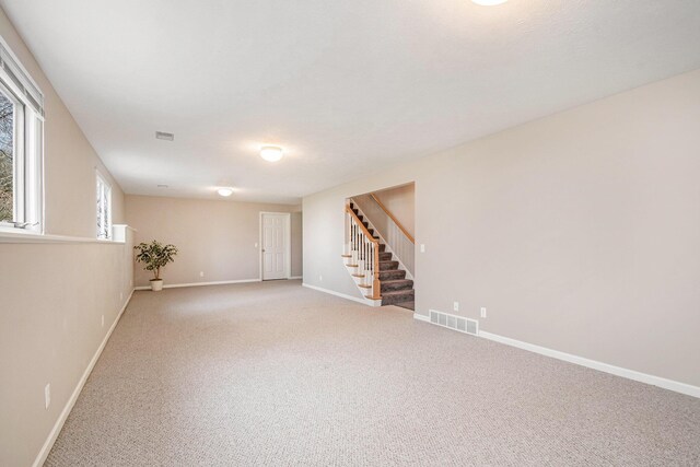 2511 Bowenton Pl SW, Wyoming, MI 49519 - basement with stairs, visible vents, light carpet, and baseboards