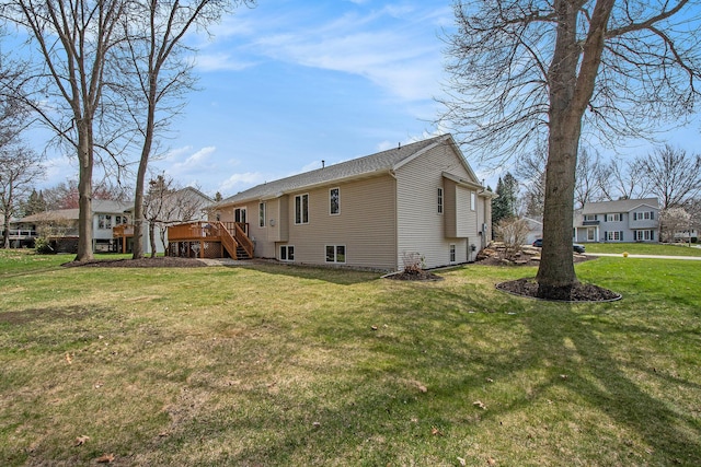 2511 Bowenton Pl SW, Wyoming, MI 49519 - view of side of home with a residential view, a lawn, a deck, and stairway