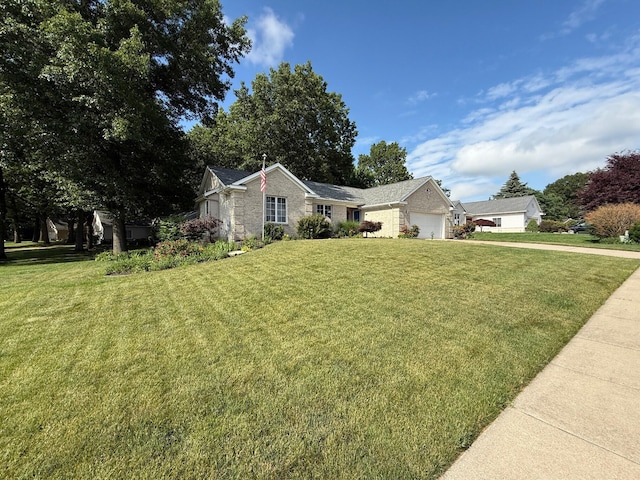 2511 Bowenton Pl SW, Wyoming, MI 49519 - ranch-style home featuring a front lawn, an attached garage, and driveway