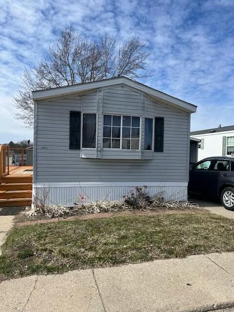 view of side of property with a deck