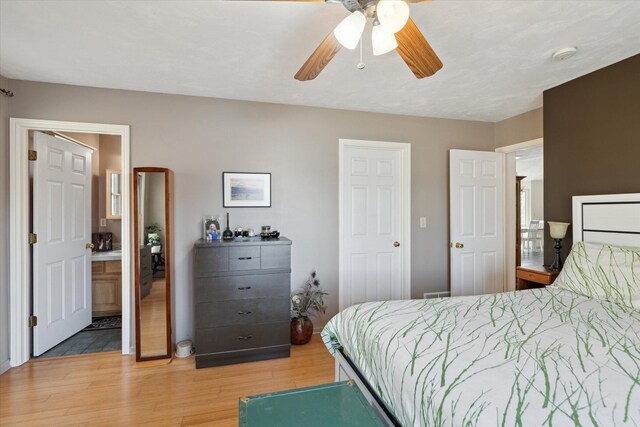 bedroom with light wood-style floors and ceiling fan
