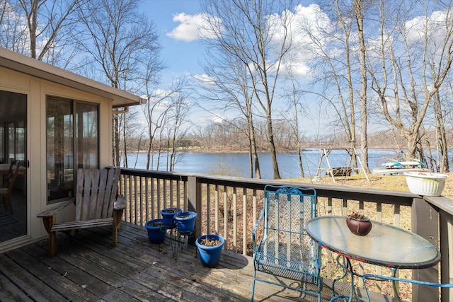 wooden deck featuring a water view