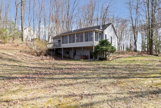 back of property featuring a sunroom