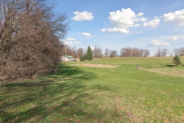 view of yard with a rural view