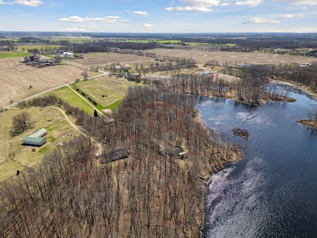birds eye view of property with a water view and a rural view
