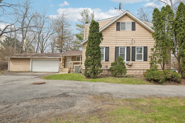 27423 W 12 Mile Rd, Farmington Hills, MI 48334 - view of front of house featuring a garage, driveway, and a chimney