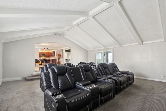 27423 W 12 Mile Rd, Farmington Hills, MI 48334 - home theater with light carpet, lofted ceiling with beams, baseboards, and arched walkways