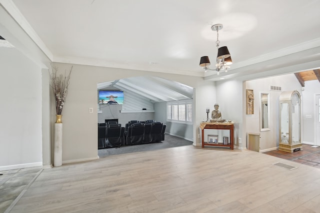 27423 W 12 Mile Rd, Farmington Hills, MI 48334 - living room featuring visible vents, vaulted ceiling, an inviting chandelier, and wood finished floors