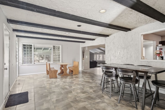27423 W 12 Mile Rd, Farmington Hills, MI 48334 - dining space with baseboards, recessed lighting, a textured ceiling, beamed ceiling, and arched walkways