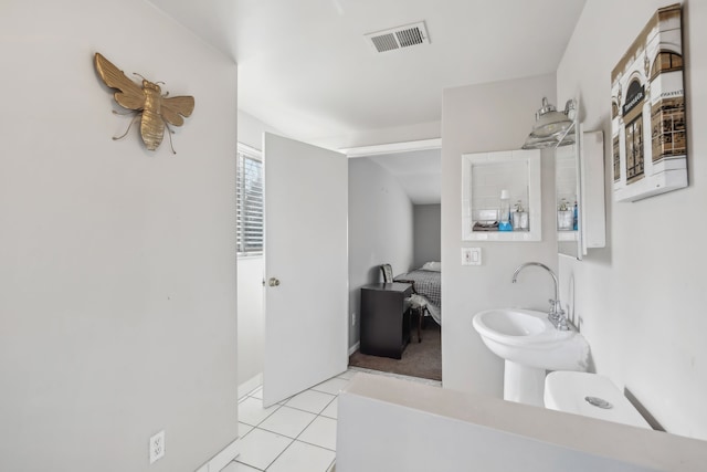 27423 W 12 Mile Rd, Farmington Hills, MI 48334 - bathroom featuring tile patterned flooring, ensuite bath, visible vents, and a sink
