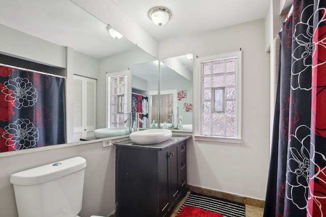 27423 W 12 Mile Rd, Farmington Hills, MI 48334 - bathroom with toilet, vanity, and baseboards