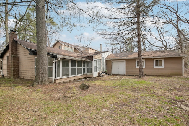 27423 W 12 Mile Rd, Farmington Hills, MI 48334 - back of property featuring a sunroom, a chimney, and a yard