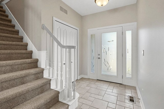 29709 Francesca Ln, Chesterfield, MI 48047 - entrance foyer with baseboards, stairs, and visible vents