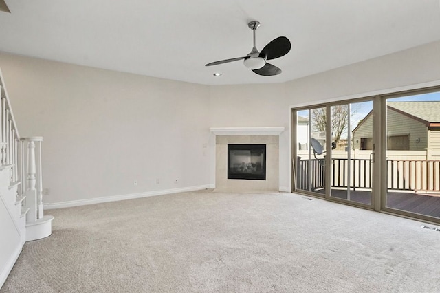 29709 Francesca Ln, Chesterfield, MI 48047 - unfurnished living room featuring baseboards, carpet floors, a ceiling fan, and stairs