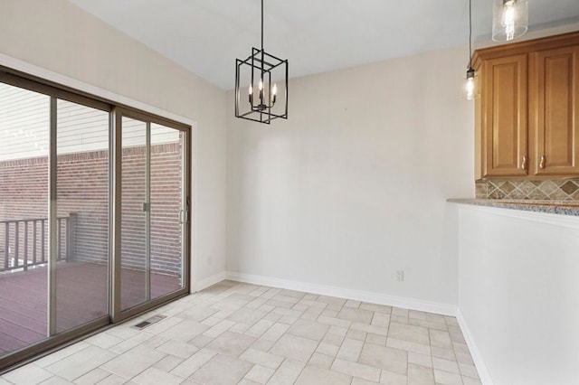 29709 Francesca Ln, Chesterfield, MI 48047 - unfurnished dining area with baseboards, visible vents, and a chandelier