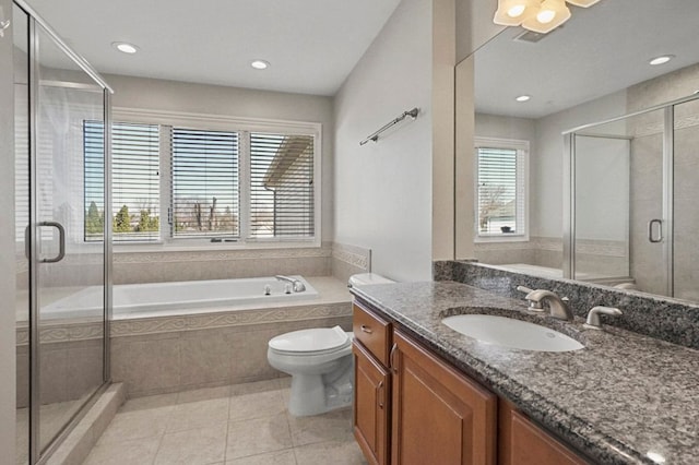 29709 Francesca Ln, Chesterfield, MI 48047 - bathroom featuring tiled bath, tile patterned floors, a stall shower, vanity, and toilet
