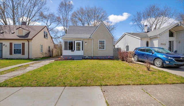view of front of house featuring a front lawn and entry steps