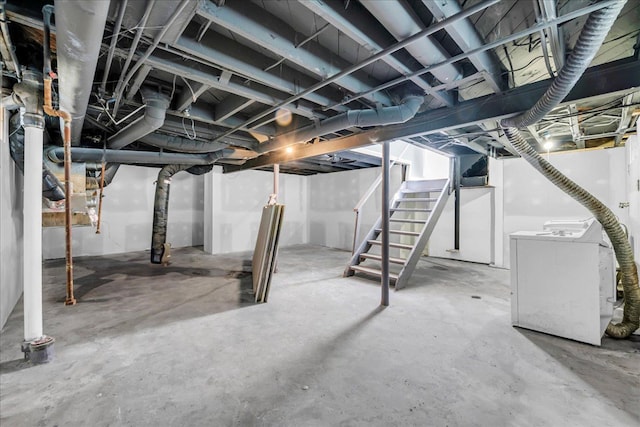 unfinished basement with independent washer and dryer and stairway