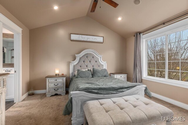 carpeted bedroom featuring baseboards, a ceiling fan, recessed lighting, ensuite bath, and vaulted ceiling
