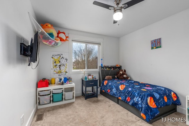 carpeted bedroom featuring visible vents, baseboards, and a ceiling fan