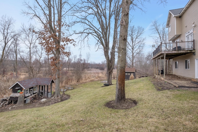 view of yard with an outbuilding and a wooden deck