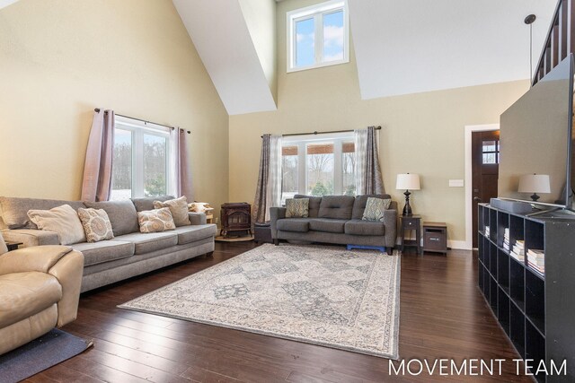 11559 Williams Rd, Montague, MI 49437 - living area featuring plenty of natural light, dark wood-style floors, and high vaulted ceiling